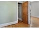 Bedroom closet with organized shelving and hardwood floors at 914 E Iowa Ave, Denver, CO 80210