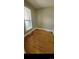 Bedroom featuring hardwood floors and bright natural light from a window at 914 E Iowa Ave, Denver, CO 80210