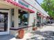 Charming cafe exterior with awnings and outdoor seating area at 914 E Iowa Ave, Denver, CO 80210