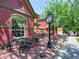 Charming restaurant with outdoor seating and a vintage clock post at 914 E Iowa Ave, Denver, CO 80210