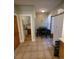 Functional dining area with a black table and bathroom in adjacent room at 914 E Iowa Ave, Denver, CO 80210