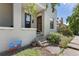 Charming exterior view of home featuring a classic brick facade, steps to the front door, and beautiful landscaping at 914 E Iowa Ave, Denver, CO 80210