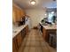Well-lit kitchen features bright counters, and stainless steel appliances at 914 E Iowa Ave, Denver, CO 80210