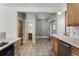 Updated kitchen featuring wood cabinets, neutral countertops, and stainless steel dishwasher at 914 E Iowa Ave, Denver, CO 80210