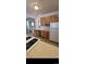 Spacious kitchen with a stainless steel dishwasher and ample countertop space at 914 E Iowa Ave, Denver, CO 80210