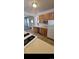 Spacious kitchen with a stainless steel dishwasher and ample countertop space at 914 E Iowa Ave, Denver, CO 80210