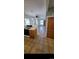 Kitchen flowing into the living room featuring modern appliances and hardwood floors at 914 E Iowa Ave, Denver, CO 80210