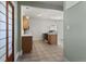 Open kitchen features tile floor, wooden cabinets, and modern appliances at 914 E Iowa Ave, Denver, CO 80210