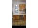 This shows the sink, countertop, microwave, and dishwasher, offering modern convenience at 914 E Iowa Ave, Denver, CO 80210