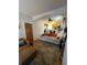 Bright and airy living room with wood floors leading into the kitchen at 914 E Iowa Ave, Denver, CO 80210