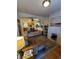 An open-concept living room flows into a kitchen with hardwood floors at 914 E Iowa Ave, Denver, CO 80210