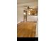 Open floor plan with hardwood floors connecting the living room to the kitchen at 914 E Iowa Ave, Denver, CO 80210