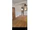 Living room with hardwood floors that connects to a kitchen and hallway at 914 E Iowa Ave, Denver, CO 80210
