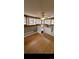 Cozy living room with hardwood floors, a ceiling fan, and bright natural light at 914 E Iowa Ave, Denver, CO 80210