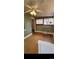 Inviting living room with hardwood floors, a ceiling fan, and bright windows at 914 E Iowa Ave, Denver, CO 80210