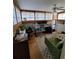 Bright office space with shoji windows, ceiling fan, modern desk and a green couch at 914 E Iowa Ave, Denver, CO 80210