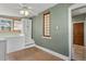 Charming room with hardwood floors, unique windows, and a ceiling fan at 914 E Iowa Ave, Denver, CO 80210