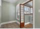 Cozy sunroom featuring unique paneled doors and bright natural light at 914 E Iowa Ave, Denver, CO 80210