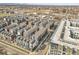 Aerial view of the modern townhome community, featuring colorful exteriors and ample parking at 1007 Chase St, Lakewood, CO 80214