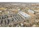 Wide aerial view of the apartment and townhome community near a lake at 1007 Chase St, Lakewood, CO 80214