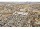 High aerial view showcases the apartment and townhome community set against the cityscape at 1007 Chase St, Lakewood, CO 80214