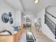 Open concept living room boasts stylish decor, modern finishes, and seamless flow to the dining area at 1007 Chase St, Lakewood, CO 80214