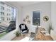 Bright home office with ample natural light, desk, and comfortable seating at 1007 Chase St, Lakewood, CO 80214