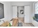 Modern office space with sliding doors, hardwood floors, desk, and neutral tones at 1007 Chase St, Lakewood, CO 80214