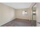 The bedroom has carpet, neutral walls, a window with blinds, and mirrored closet doors at 4681 S Decatur St # 227, Englewood, CO 80110