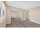 The bedroom offers carpet, neutral walls, a mirrored closet, and good natural light from the window at 4681 S Decatur St # 227, Englewood, CO 80110