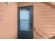 Close-up of the unit's front door with modern screen and painted trim that complements the overall exterior at 4681 S Decatur St # 227, Englewood, CO 80110
