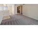 Open living room with carpeting and a view into the kitchen, creating an inviting space for entertaining and relaxation at 4681 S Decatur St # 227, Englewood, CO 80110