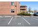 A dedicated parking space in a lot near a two-story building, offering convenient and accessible parking at 4681 S Decatur St # 227, Englewood, CO 80110
