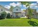 A lush backyard and outdoor living space provides an idyllic and private retreat at 6142 Gorham St, Frederick, CO 80530