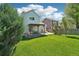 The home boasts a spacious backyard with a covered patio, perfect for outdoor living at 6142 Gorham St, Frederick, CO 80530