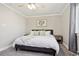 Comfortable bedroom showcasing soft neutral tones, plush carpet, and bright natural light from the window at 6142 Gorham St, Frederick, CO 80530