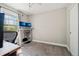 Bright bedroom showcasing a modern adjustable desk and a large window that provides natural light at 6142 Gorham St, Frederick, CO 80530