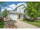 Charming two-story home featuring a well-maintained lawn and inviting curb appeal on a sunny day at 6142 Gorham St, Frederick, CO 80530