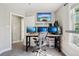 Functional office with multiple monitors and stylish decor at 6142 Gorham St, Frederick, CO 80530