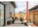 Relaxing back patio offers an outdoor lounge area with comfortable seating, creating a perfect retreat at 6251 N Galena St, Denver, CO 80238