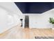 Spacious finished basement with wood floors and painted accent ceiling at 6251 N Galena St, Denver, CO 80238
