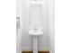 Contemporary bathroom with pedestal sink and large rectangular mirror at 6251 N Galena St, Denver, CO 80238