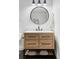 Modern bathroom with wood vanity and ample storage with trendy black hardware at 6251 N Galena St, Denver, CO 80238