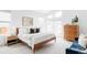 Light and airy bedroom featuring large windows, a cozy bed, and modern furnishings at 6251 N Galena St, Denver, CO 80238