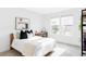 Serene bedroom with large windows, providing ample natural light and a tranquil ambiance at 6251 N Galena St, Denver, CO 80238