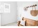 A cute entryway featuring a bench with pillows, hat, and a woven tote bag at 6251 N Galena St, Denver, CO 80238