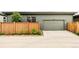 Attached two-car garage with a paved driveway, providing convenient parking and home access at 6251 N Galena St, Denver, CO 80238