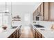A spacious kitchen with wooden cabinets, stainless steel appliances, and a large island at 6251 N Galena St, Denver, CO 80238