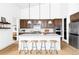 Modern kitchen with stainless steel appliances, granite countertops, a large island, and plenty of cabinets at 6251 N Galena St, Denver, CO 80238