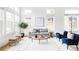 Bright, inviting living room with high ceilings, large windows, and contemporary decor featuring a neutral palette at 6251 N Galena St, Denver, CO 80238